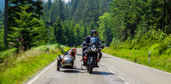 Man riding motorcycle on road