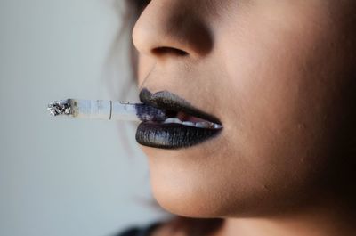 Close-up of woman smoking cigarette