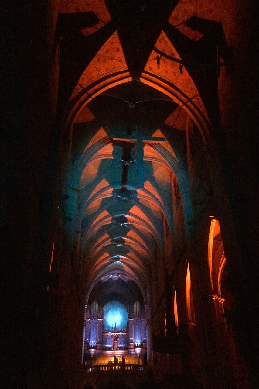 arch, indoors, ceiling, architecture, built structure, arched, archway, illuminated, in a row, corridor, dark, interior, tourism, diminishing perspective, the way forward, lit, history, no people, colonnade, electric light, interiors, architectural column