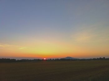 Scenic view of landscape at sunset