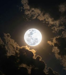 Low angle view of moon against sky at night