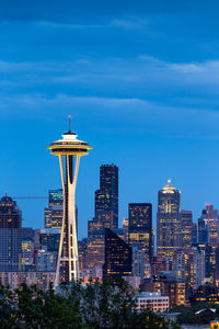 Modern buildings in city against sky