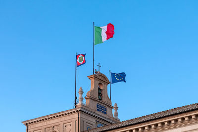 Quirinal, the bell tower and the waving flags. institutional seat of the president italian republic.