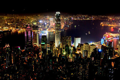 High angle view of illuminated city buildings at night