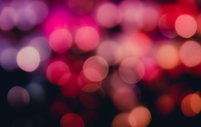 Defocused image of colorful illuminated lights at night