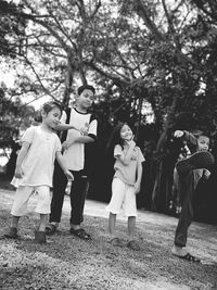 Kids playing on grassy field at park