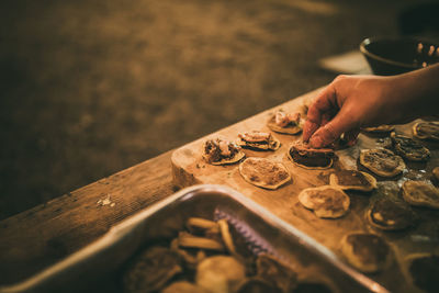 Close-up of hands on table