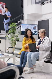 Portrait of female doctor working in office