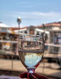 Close-up of wineglass against built structure