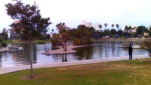 View of people in calm lake