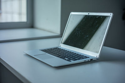 Close-up of laptop on table