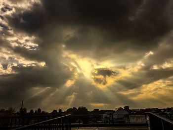 Panoramic view of city against dramatic sky