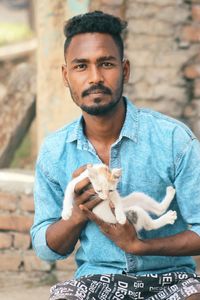 Portrait of young man using mobile phone