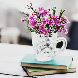 Glass jug with wax flower