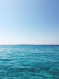 Scenic view of calm sea against clear sky