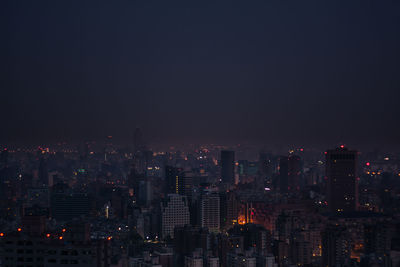 Illuminated cityscape at night