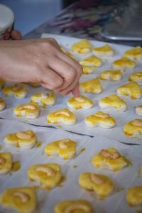 Midsection of person preparing food in kitchen