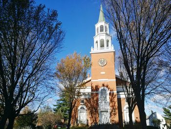 Low angle view of bell tower against sky