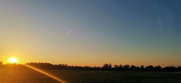 Scenic view of sunset over landscape