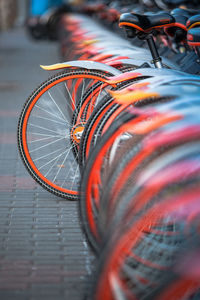 Close-up of bicycle parked on street in city