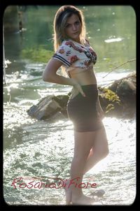 Portrait of young woman in water