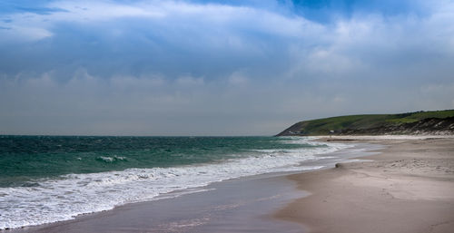 Scenic view of beach against sky