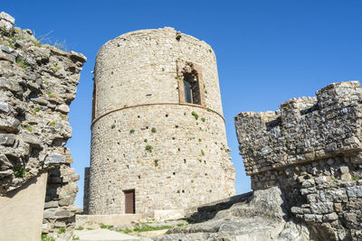 Old ruins against clear blue sky