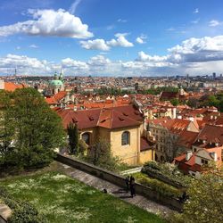 View of town against cloudy sky