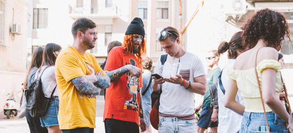 People standing on street in city