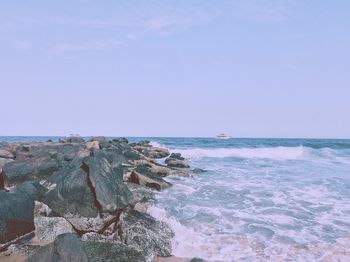 Scenic view of sea against clear blue sky