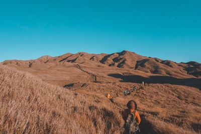 Scenic view of mountains against clear blue sky