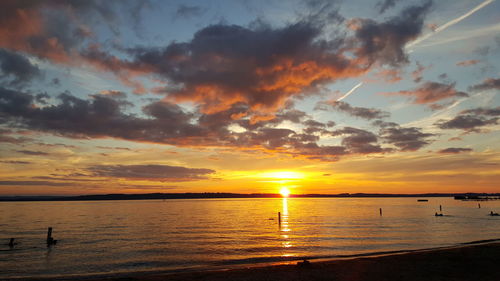 Scenic view of lake against sky during sunset