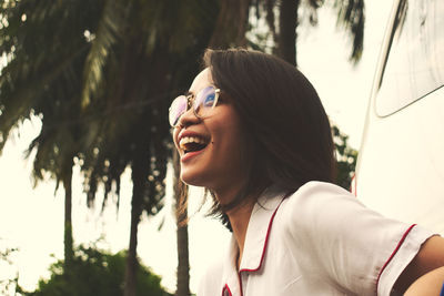 Side view portrait of woman smiling