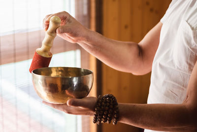 Midsection of man preparing food