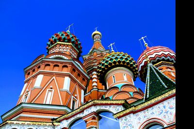 Low angle view of temple against clear blue sky