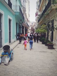 People walking on street in city