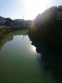 Bridge over river with buildings in background