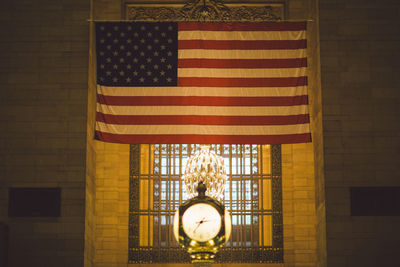 Close-up of flag on window