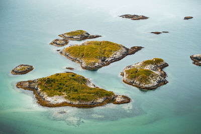 Scenic view of norwegian rocky islands in blue waters. ideal for nature, travel, coastal projects. 