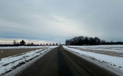 Snow covered trees against sky