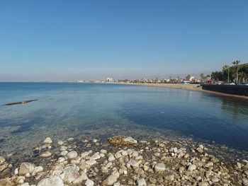 Scenic view of sea against clear blue sky