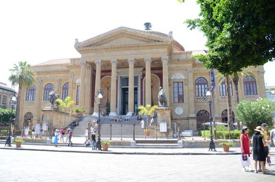 People in front of historical building