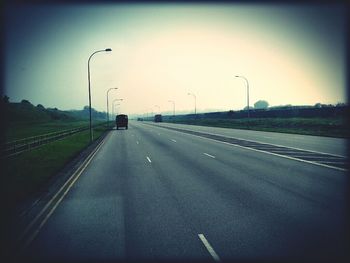 Empty road along landscape