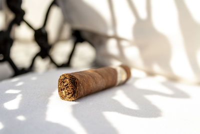 Close-up of cigarette on table