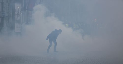 Man standing in foggy weather