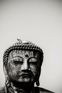 Close-up of statue against clear sky