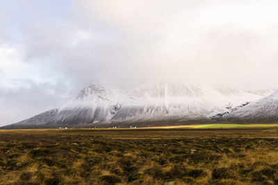 Scenic view of snowcapped landscape against sky