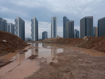 Buildings in city against sky