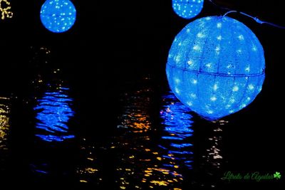 Close-up of illuminated lights at night