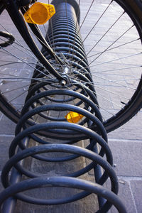 High angle view of bicycle wheel by street
